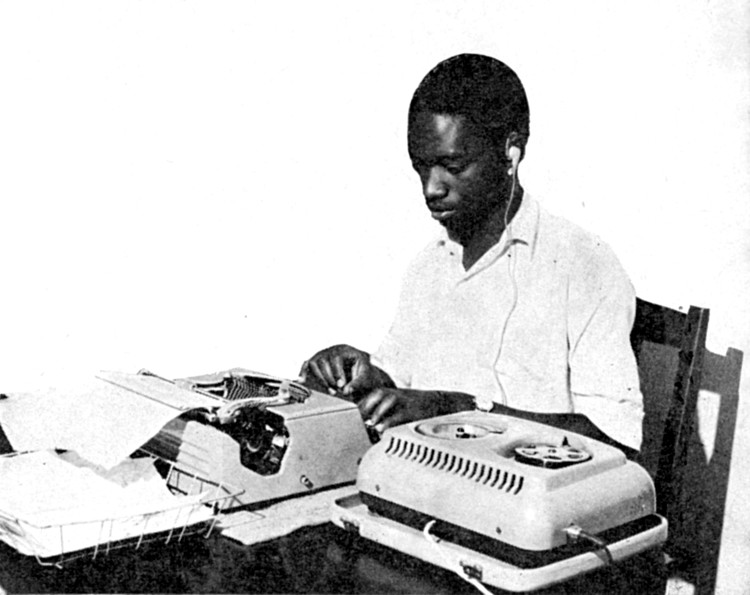 [An African using a dictating machine and typewriter]